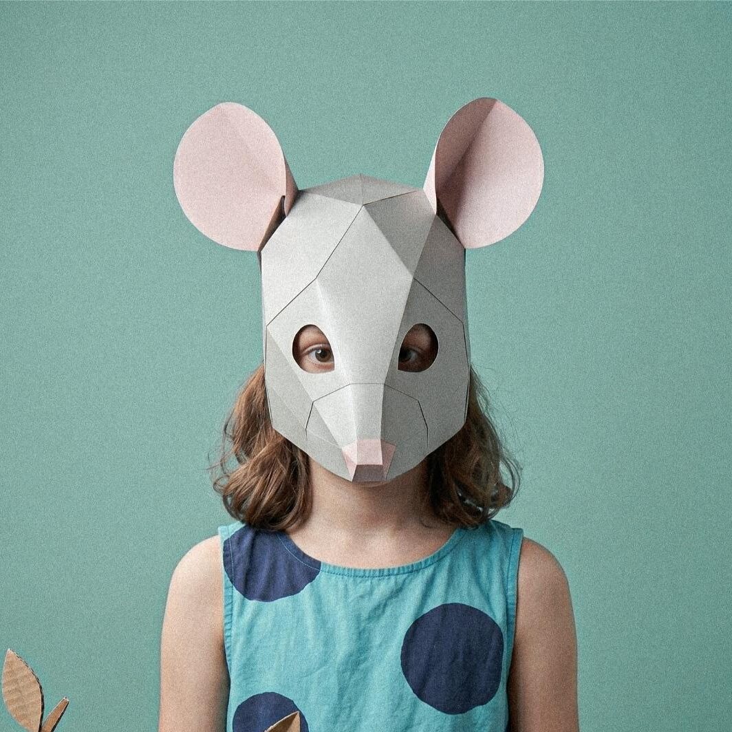 Child wearing the paper mouse mask template in a school play costume