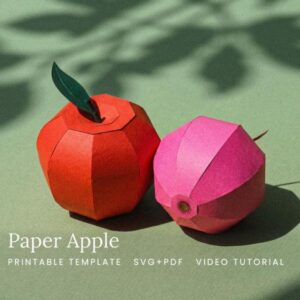 Apple sculpture mad e out of paper.