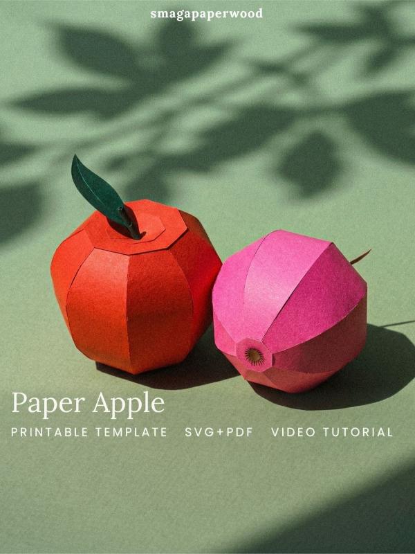 Apple sculpture mad e out of paper.